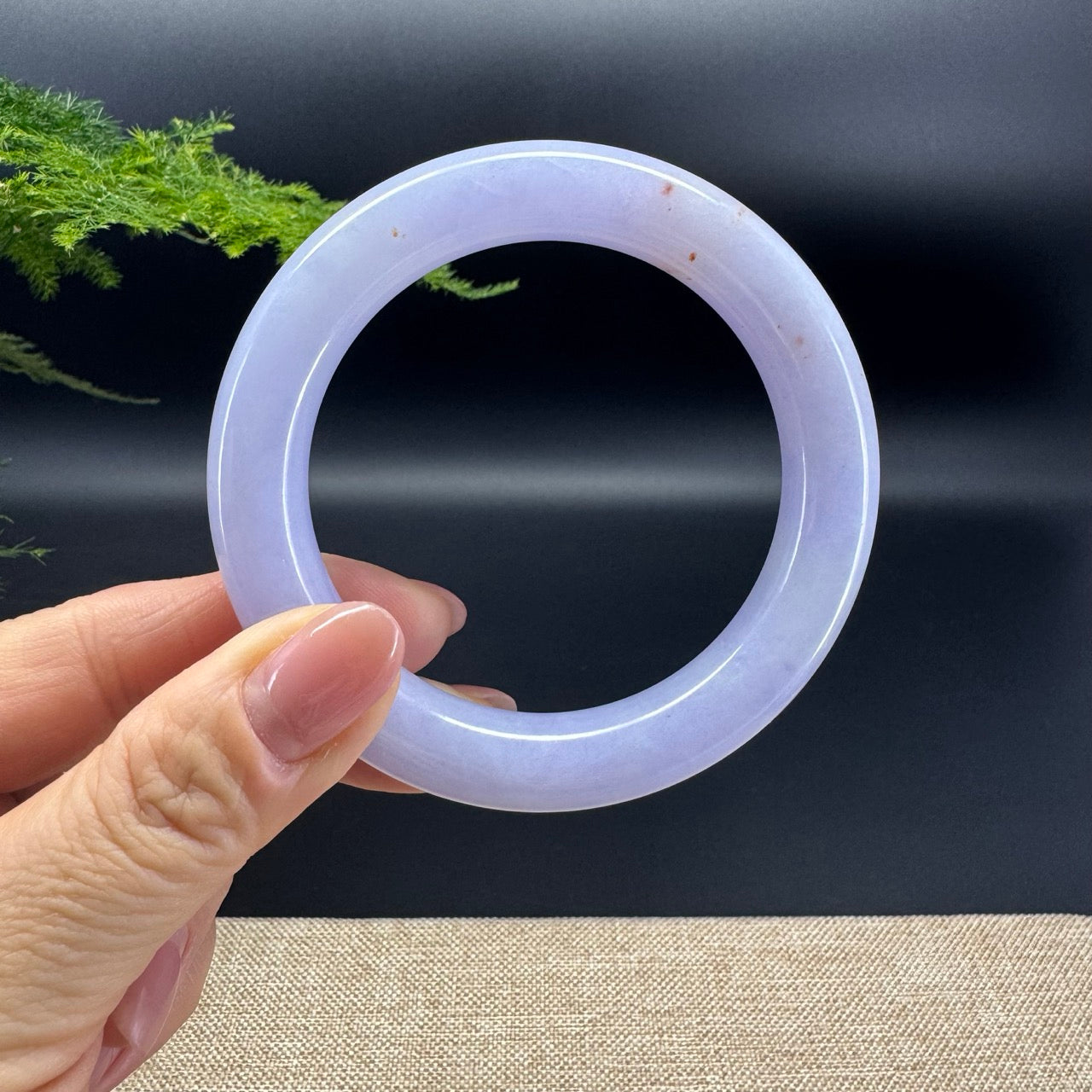 The shape of the bangle is traditional round.The bangle color is lavender and sajin. 