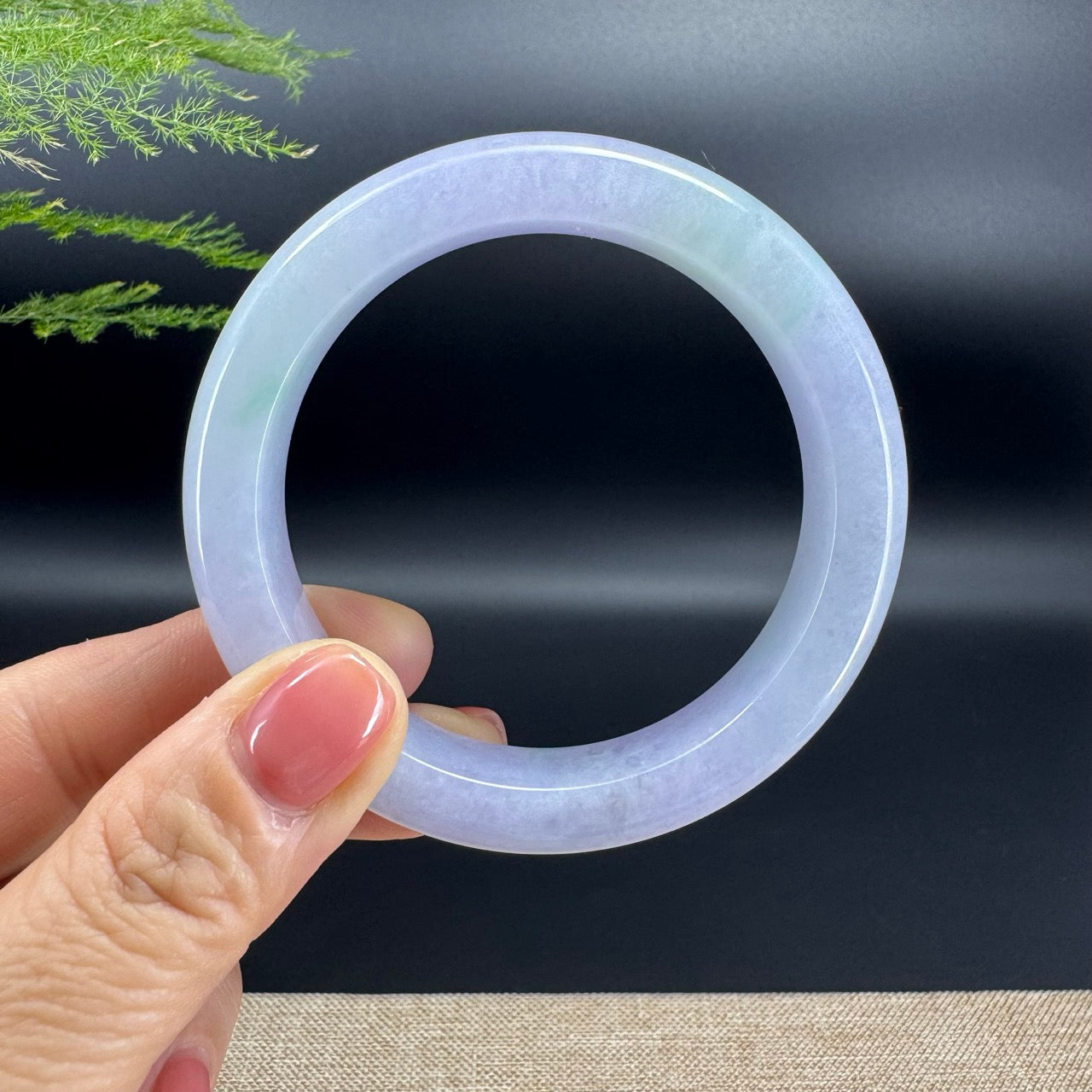 The bangle shape of the half round.The bangle color is lavender green.
