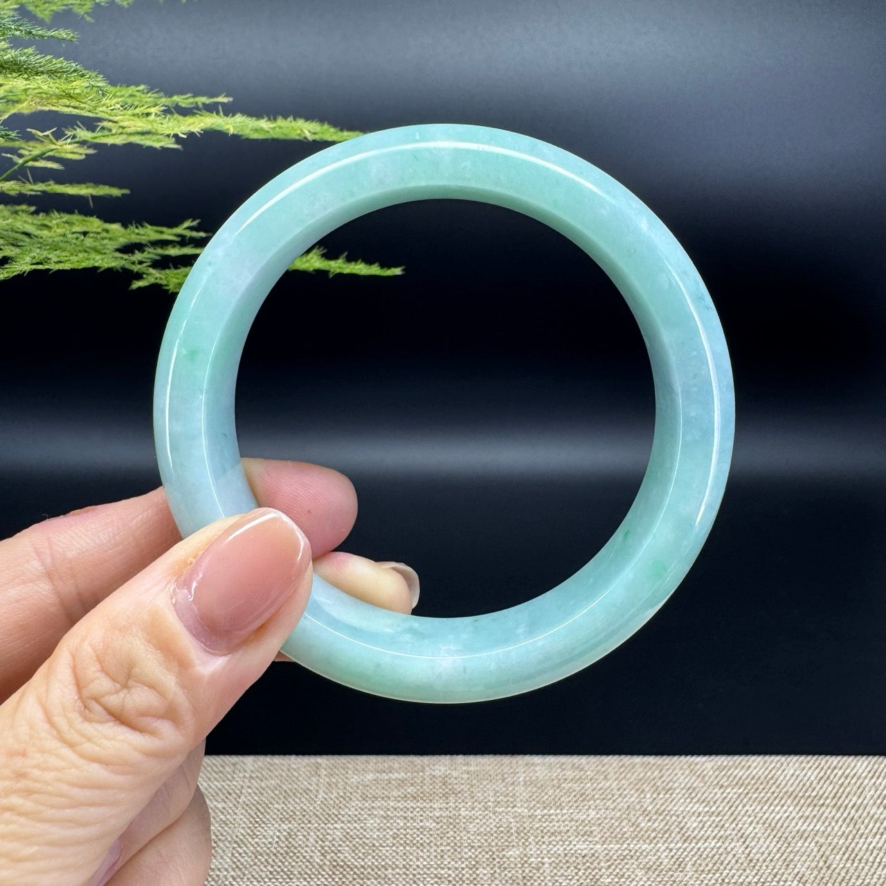 The bangle shape of the half round.The bangle color is icy apple green.