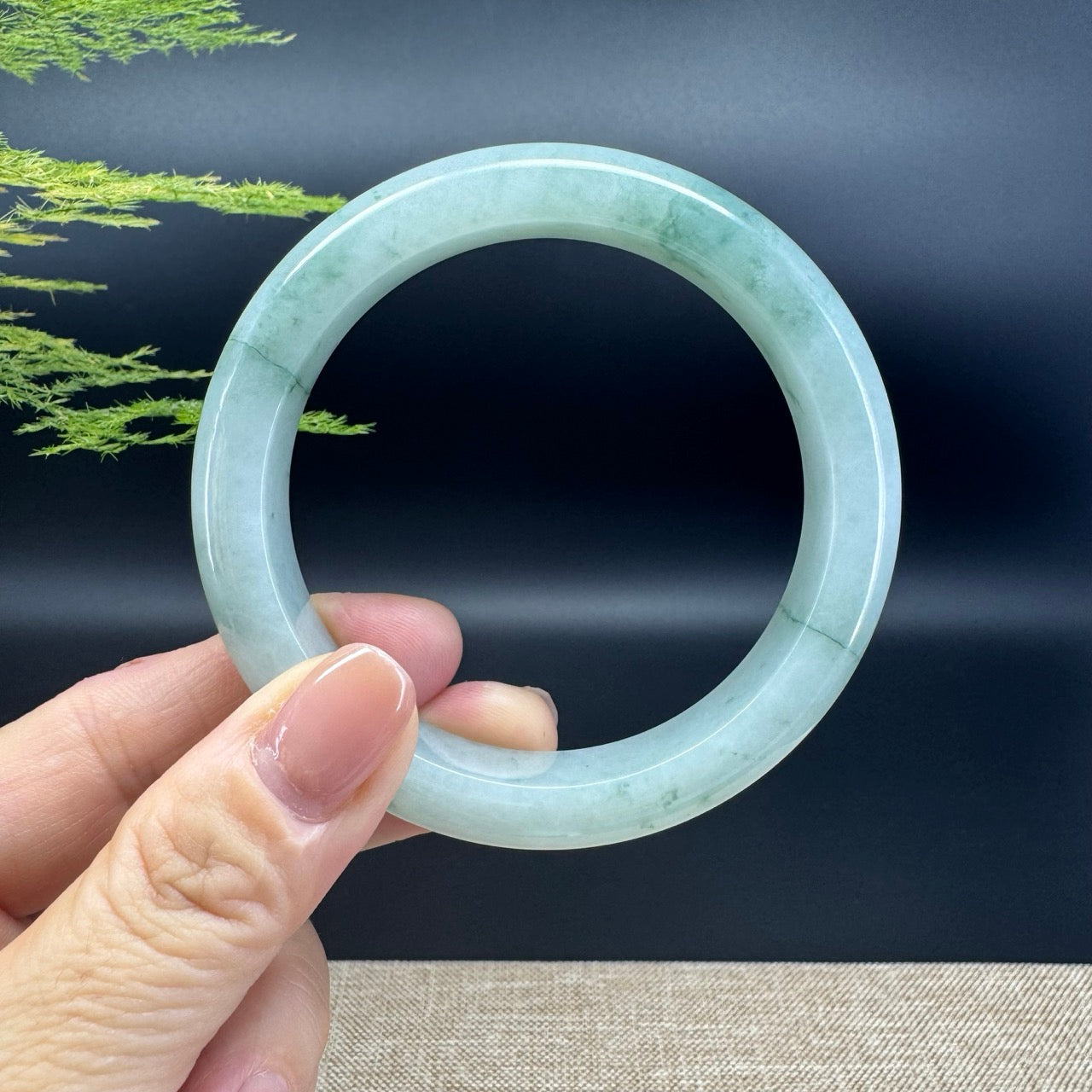The bangle shape of the half round.The bangle color is icy green.