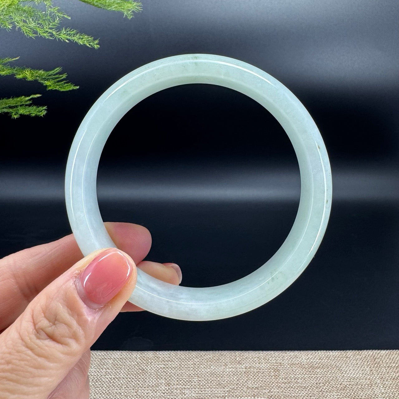 The bangle shape of the half round.The bangle color is green.