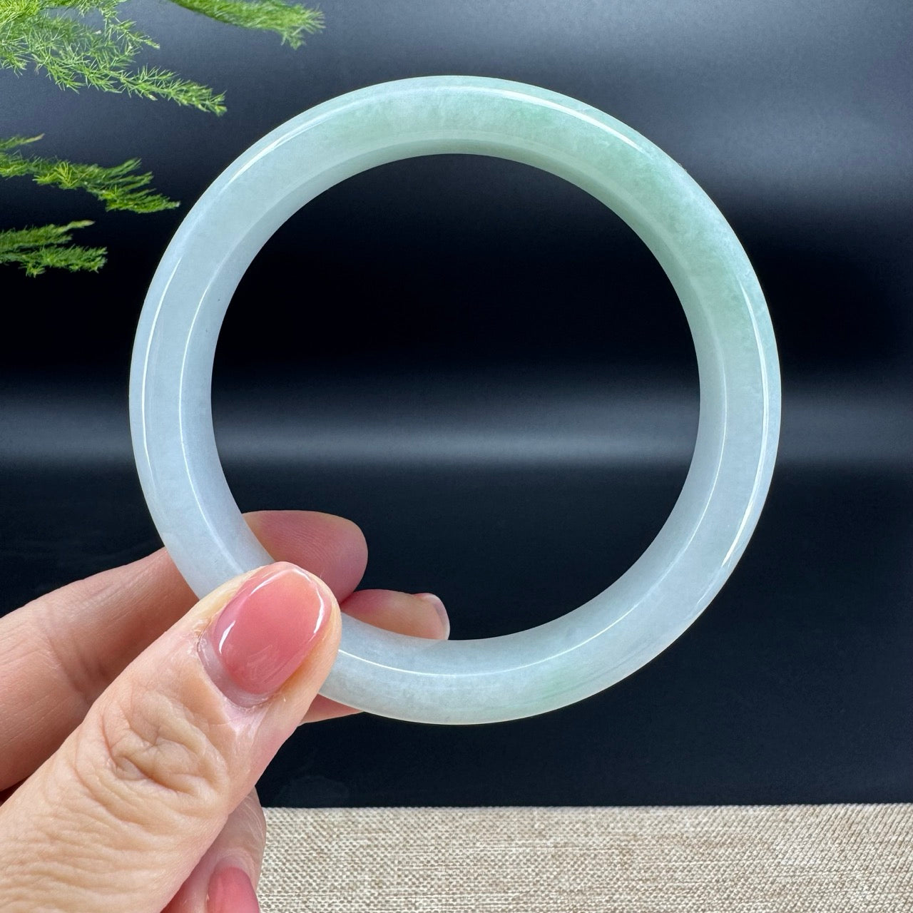 The bangle shape of the half round.The bangle color is green.