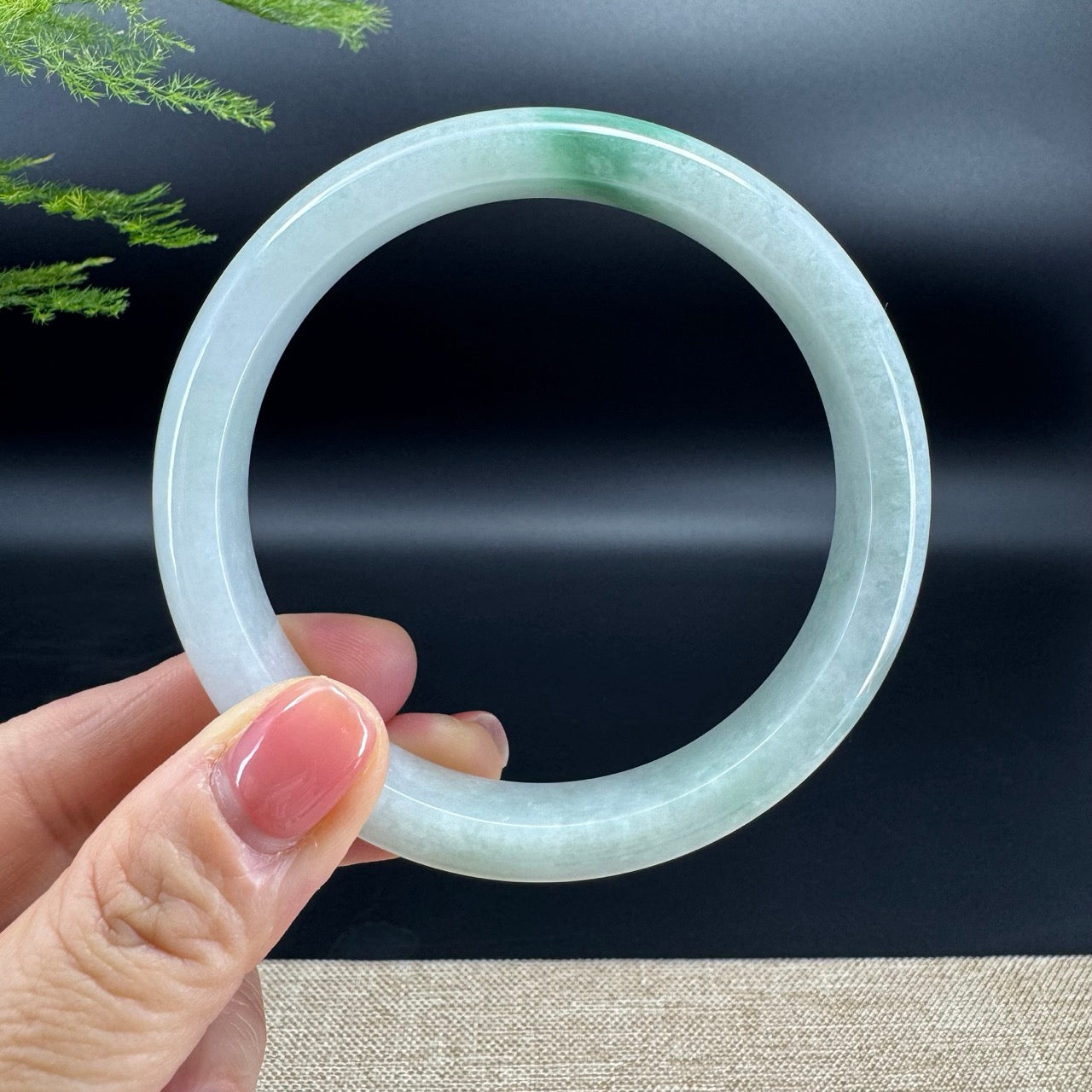 The bangle shape of the half round.The bangle color is green.