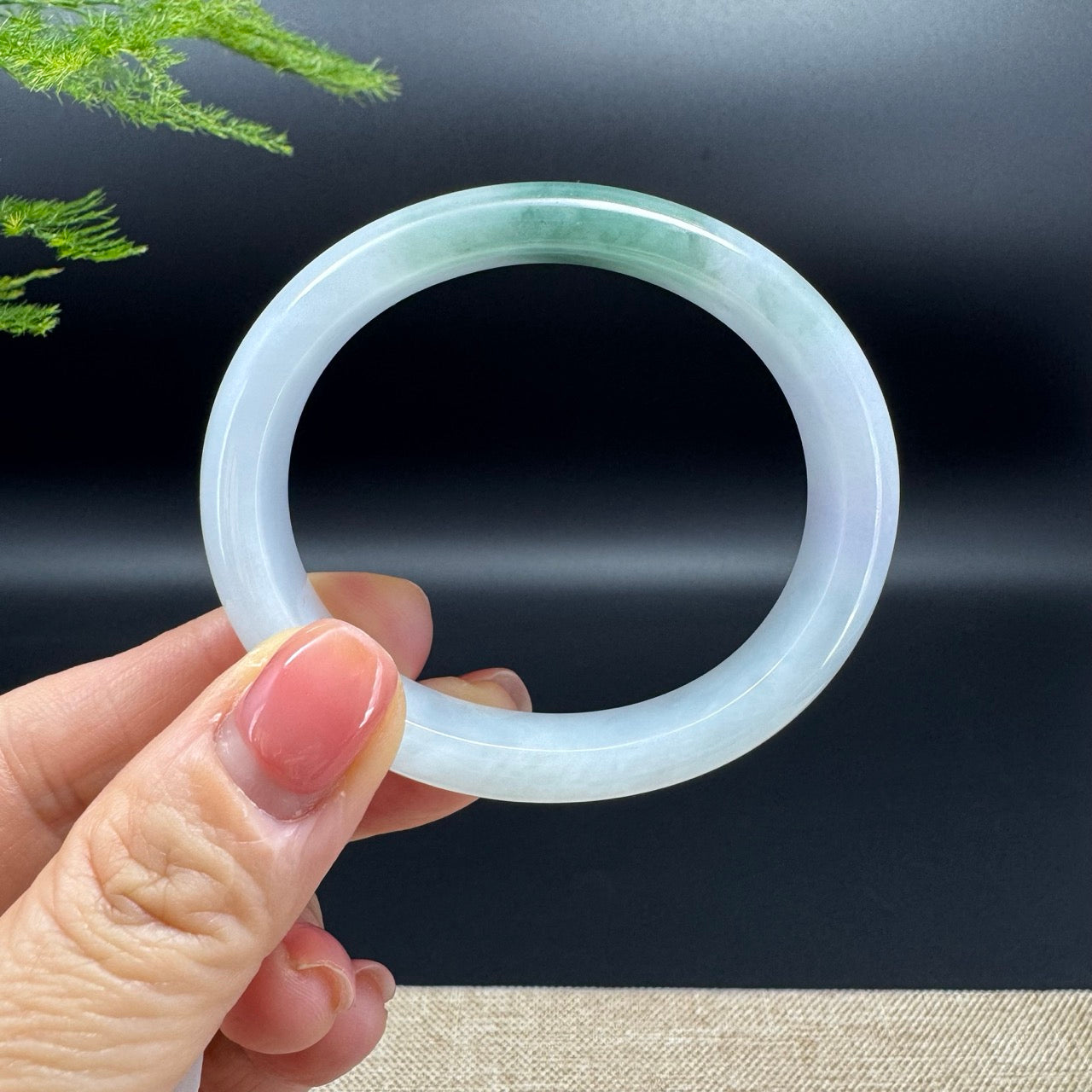 The bangle shape of the oval half round.The bangle color is icy green.