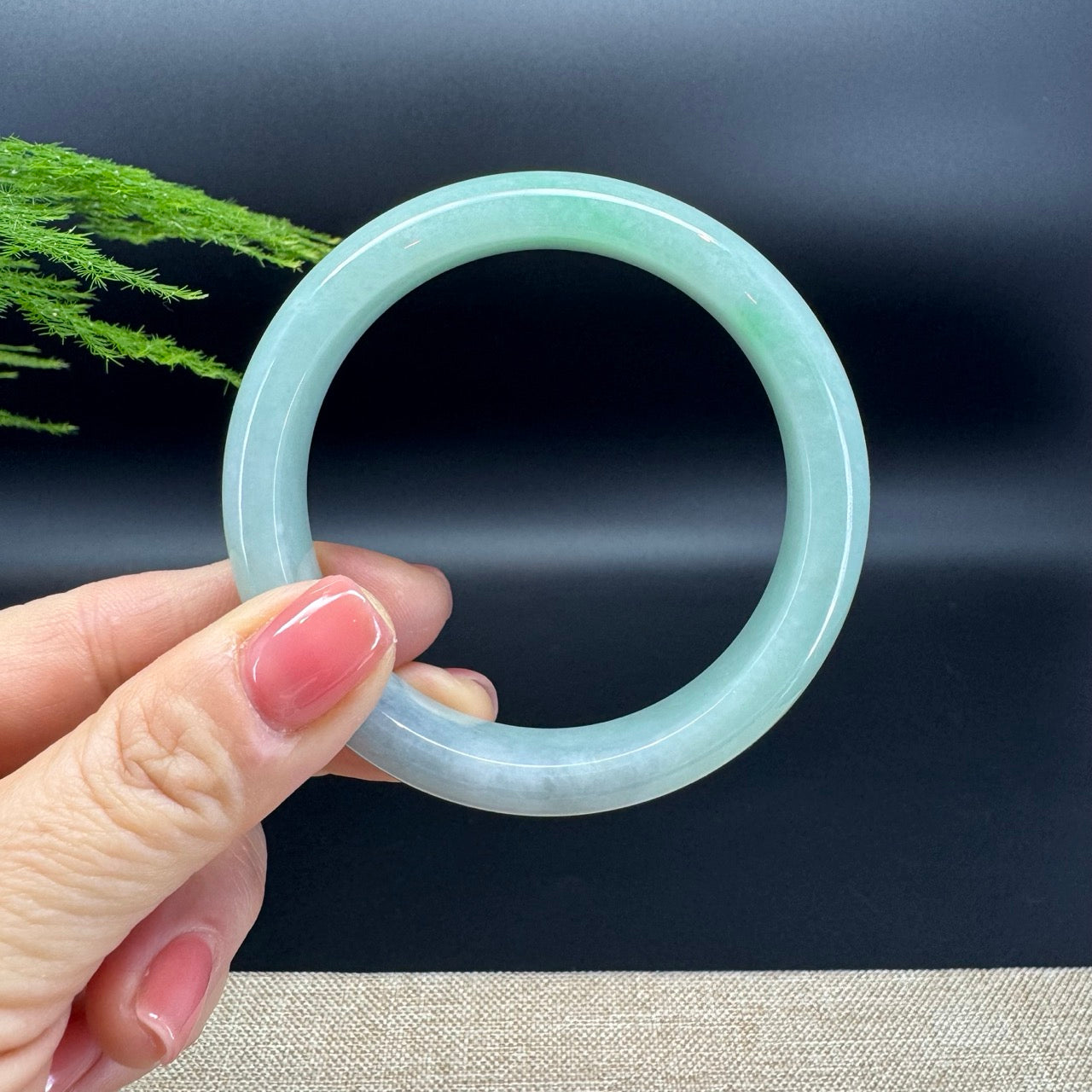 The bangle shape of the half round.The bangle color is blue green.