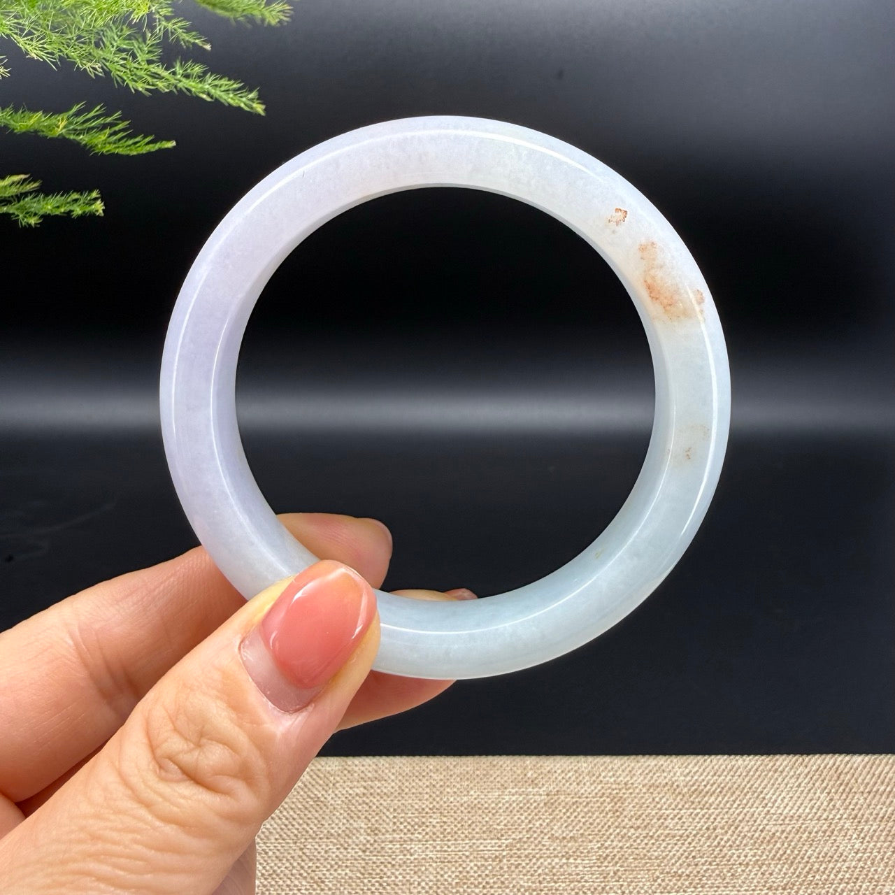 The bangle shape of the half round.The bangle color is lavender green and some sajin.