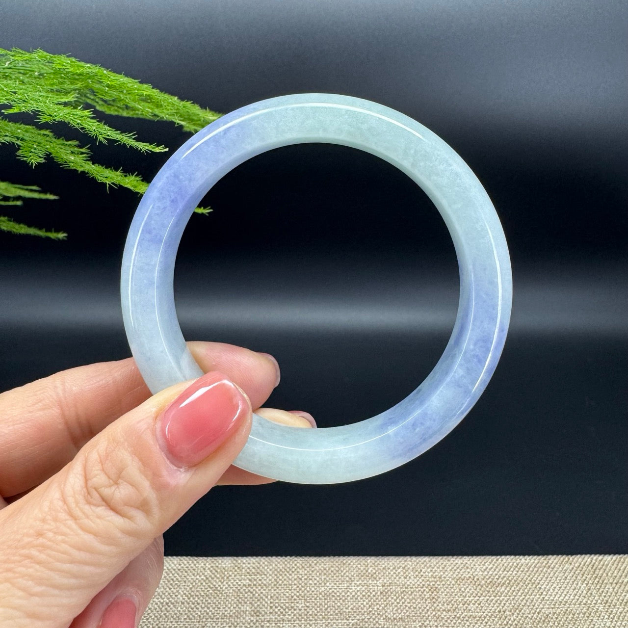 The bangle shape of the half round.The bangle color is purple green.