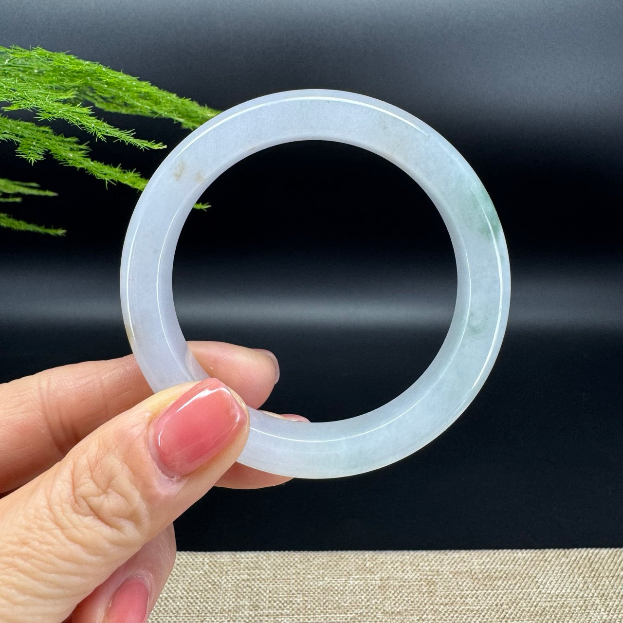 The bangle shape of the half round.The bangle color is lavender green.