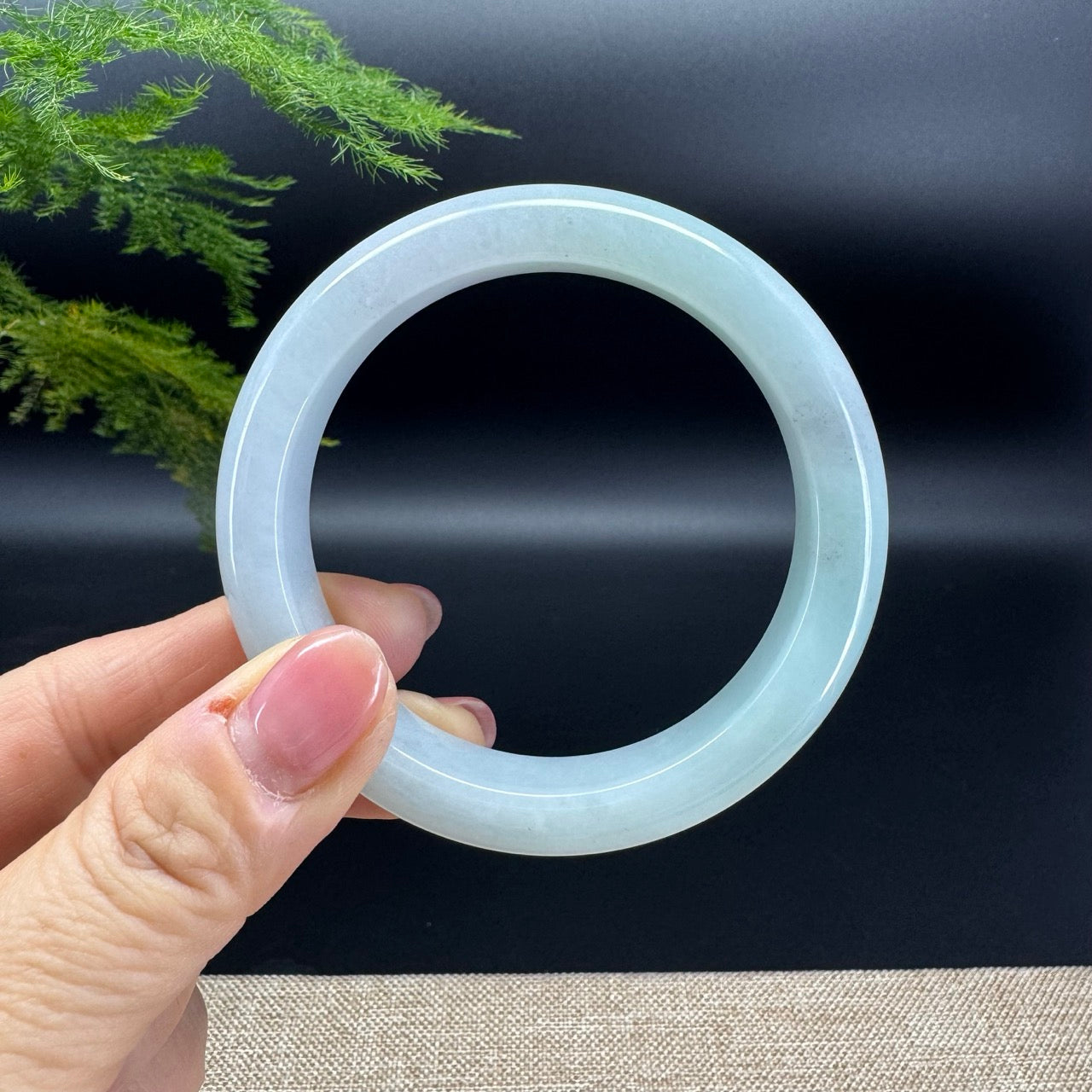 The bangle shape of he half round.The bangle color is white green base and a little wuji.