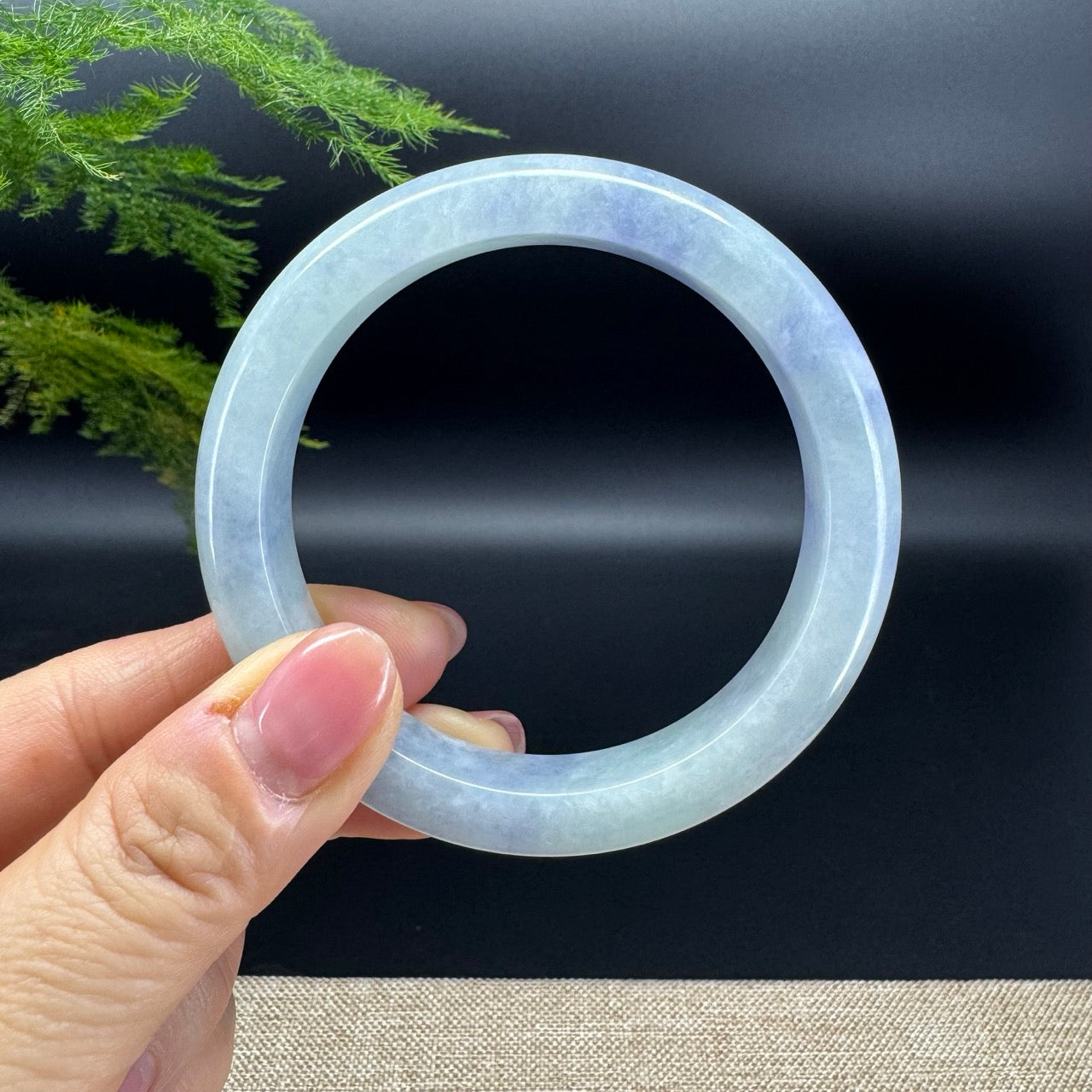 The bangle shape of the half round.The bangle color like is blueberries