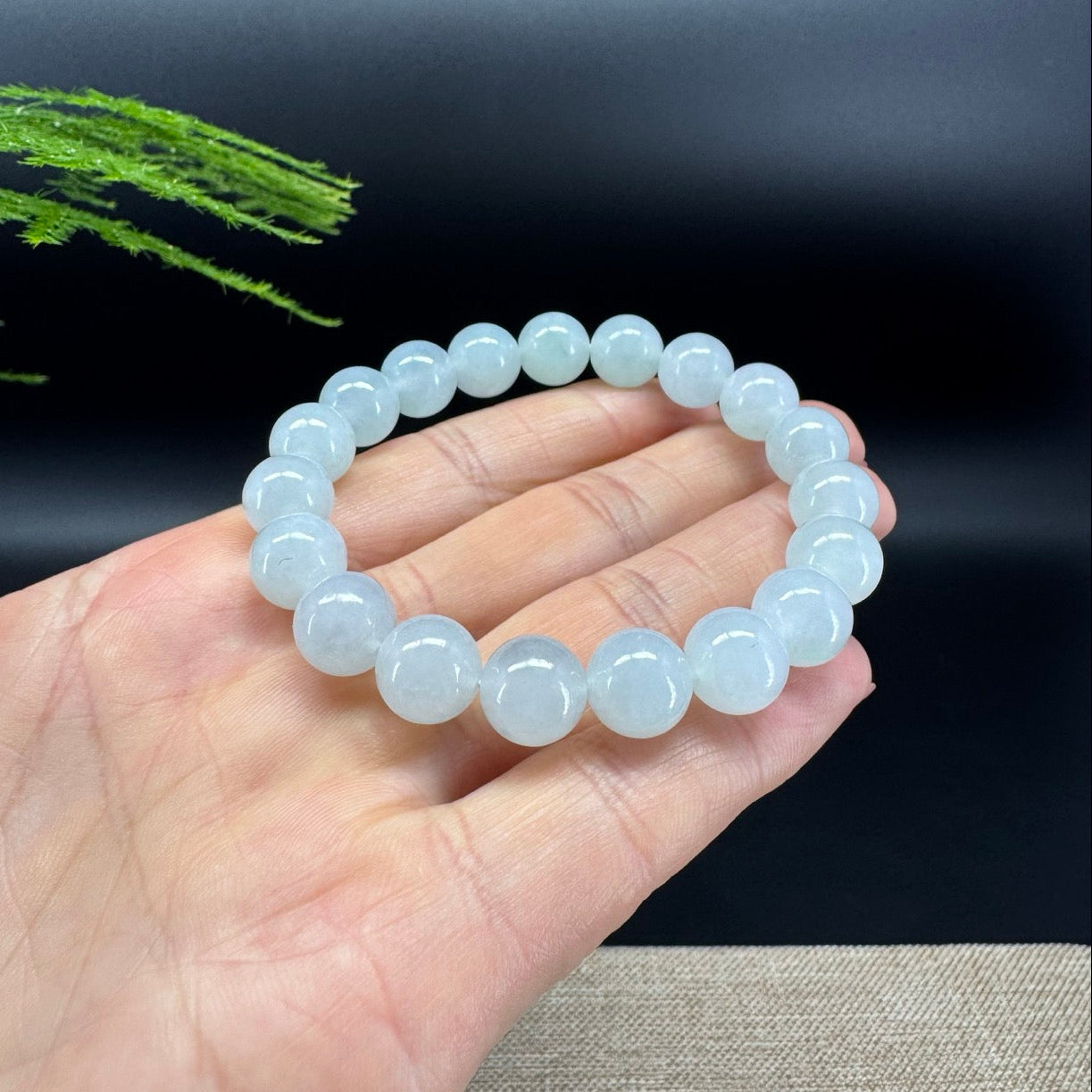The beads bracelets shape of the round,and the color is icy.