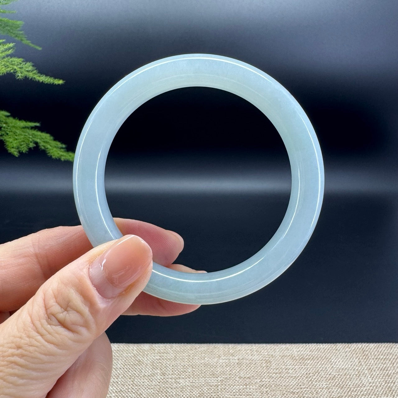 The bangle shape of the half round.The bangle color is icy.
