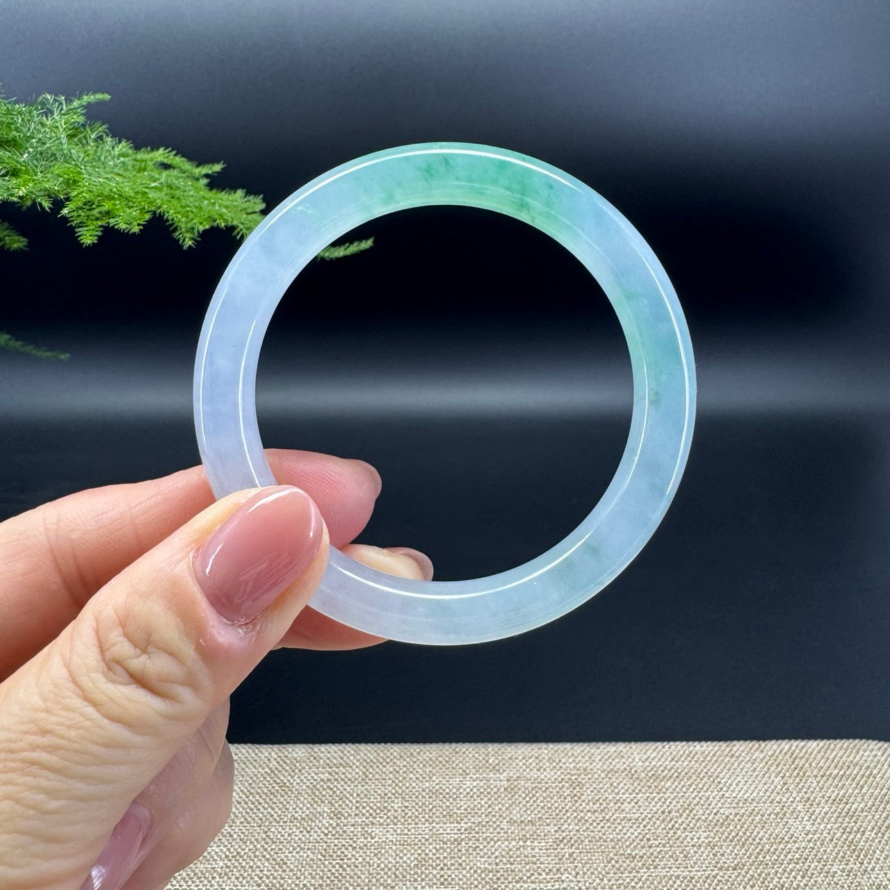 The bangle shape of the half round.The bangle color is icy green.