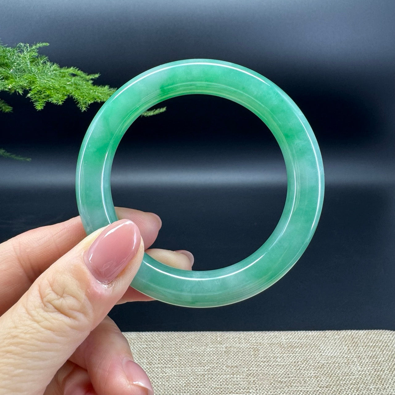 The bangle shape of the half round.The bangle color is icy green.
