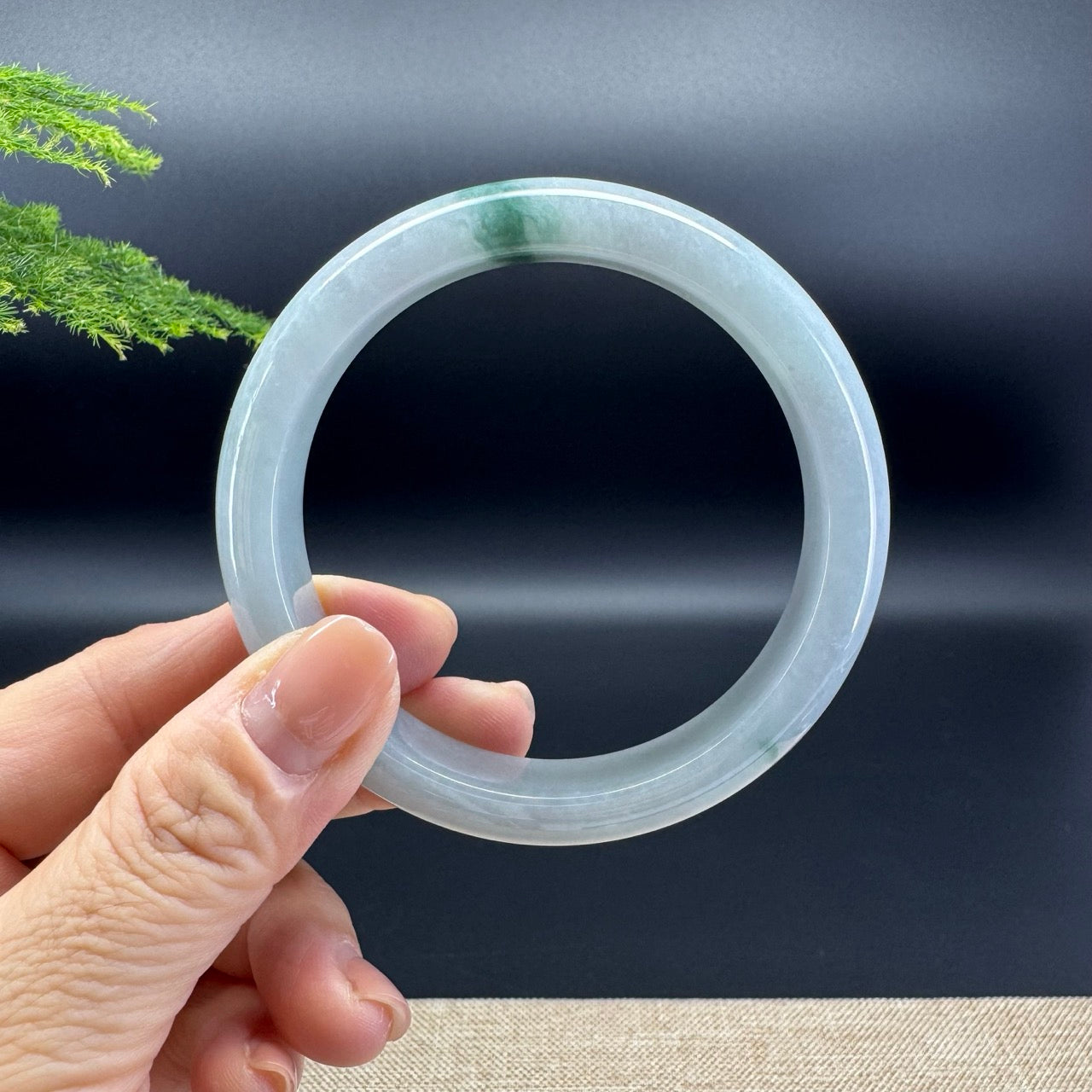 The bangle shape of the half round.The bangle color is icy green.