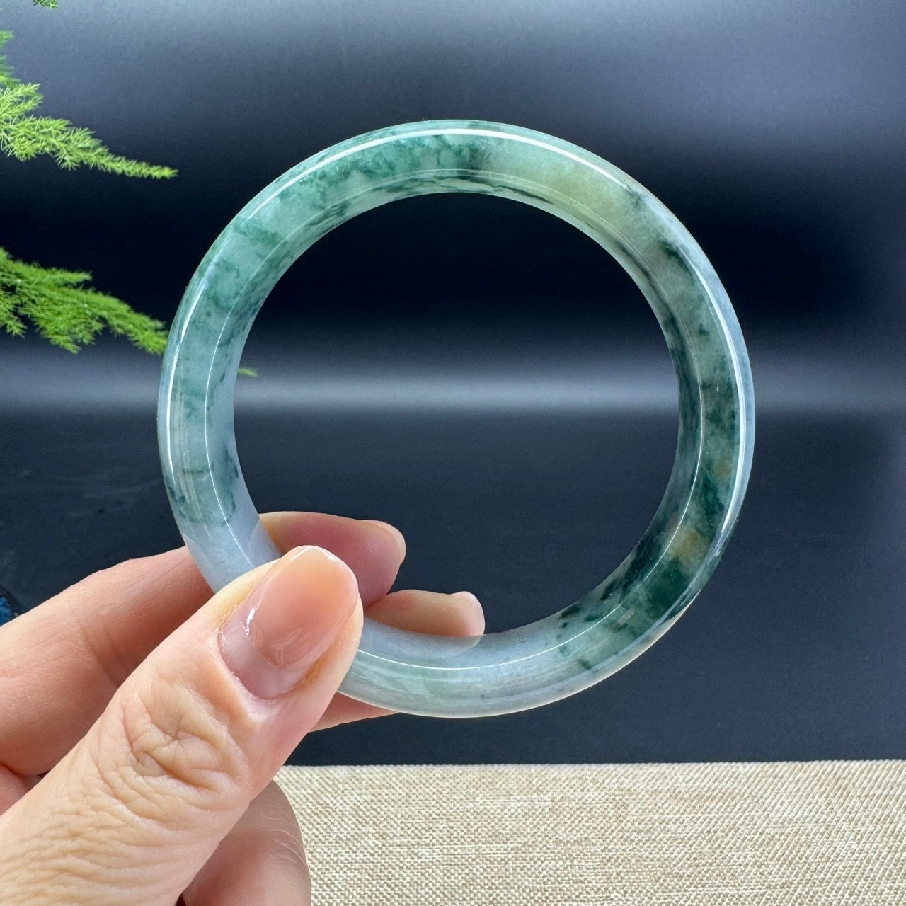 The bangle shape of the half round.The bangle color is oil green.