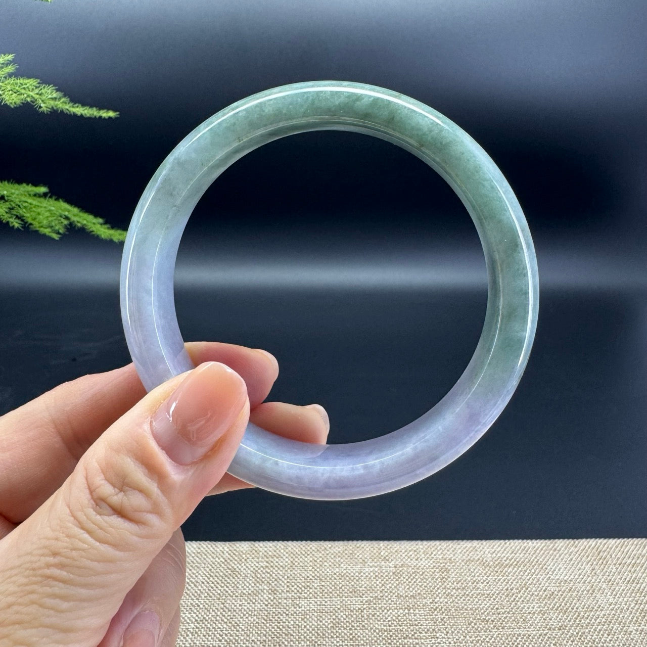 The bangle shape of the half round.The bangle colors are lavender and green.