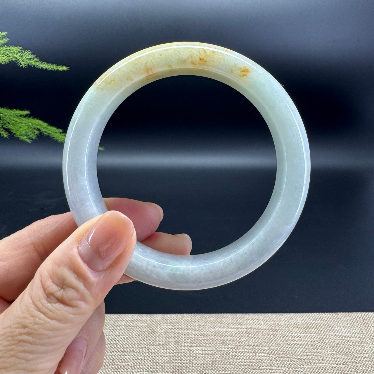 The bangle shape of the half round.The bangle colors are lavender green and some sajin.
