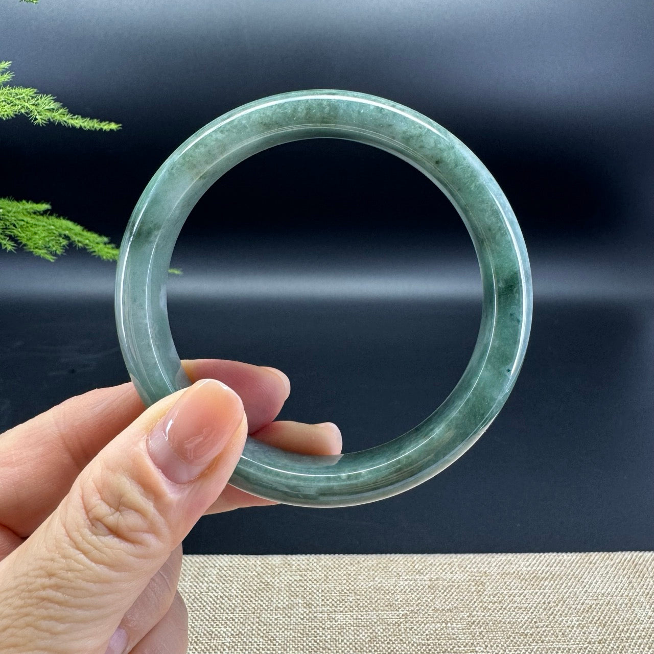 The bangle shape of the half round.The bangle color  is green.
