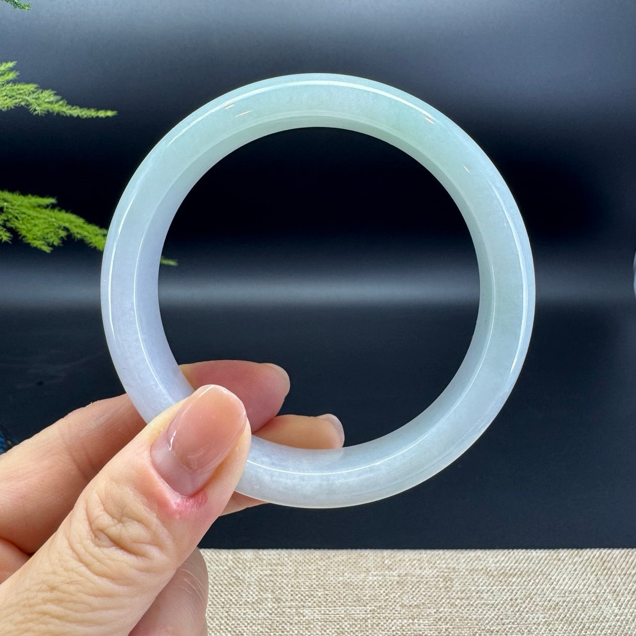 The bangle shape of the half round.The bangle colors are lavender and green.