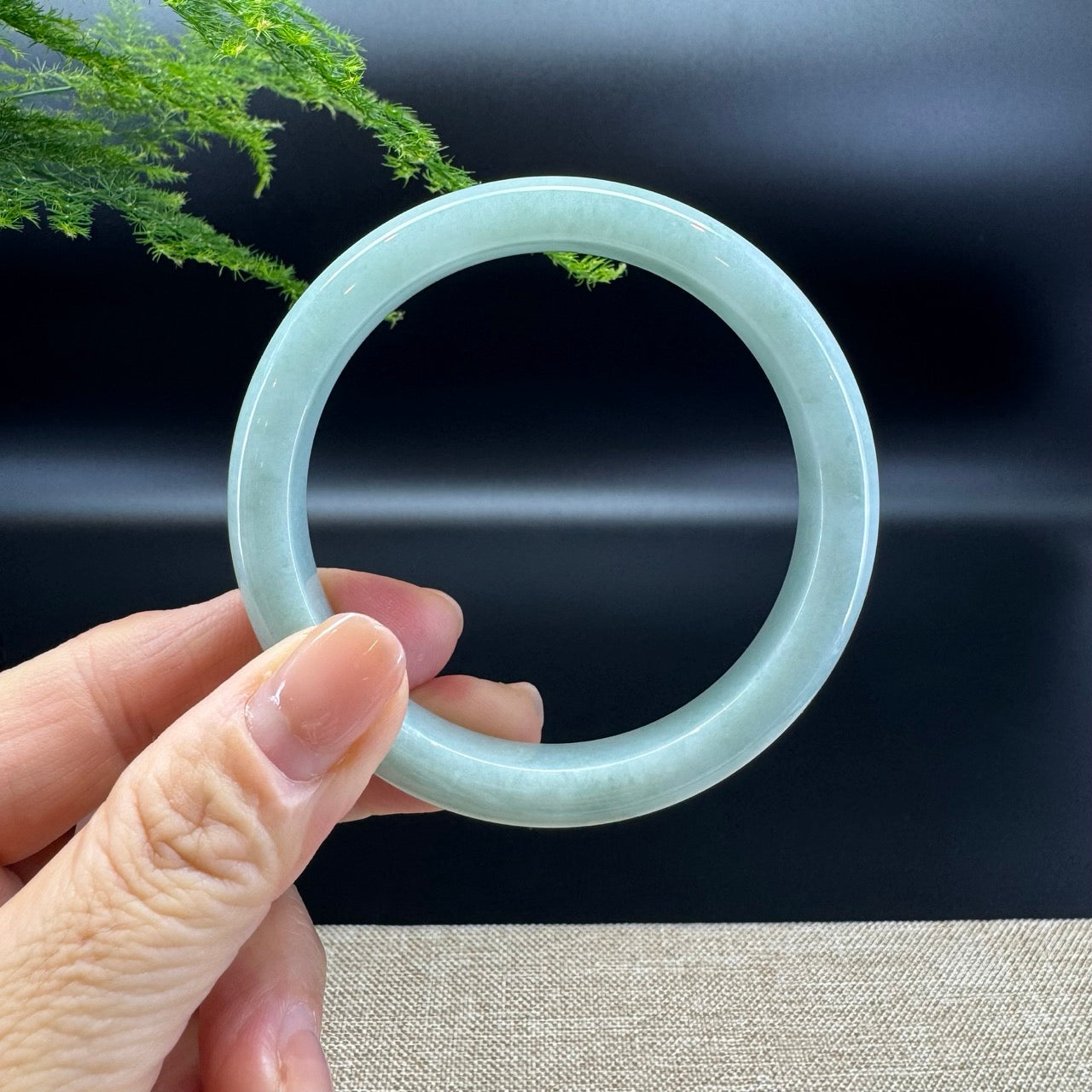 The bangle shape of the half round.The bangle color is apple green.