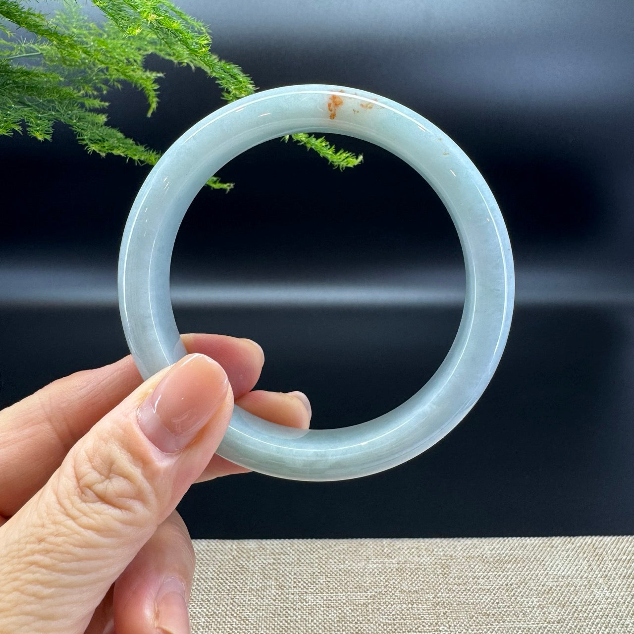 The bangle shape of the half round.The bangle color is lavender green and a bit of sajin.