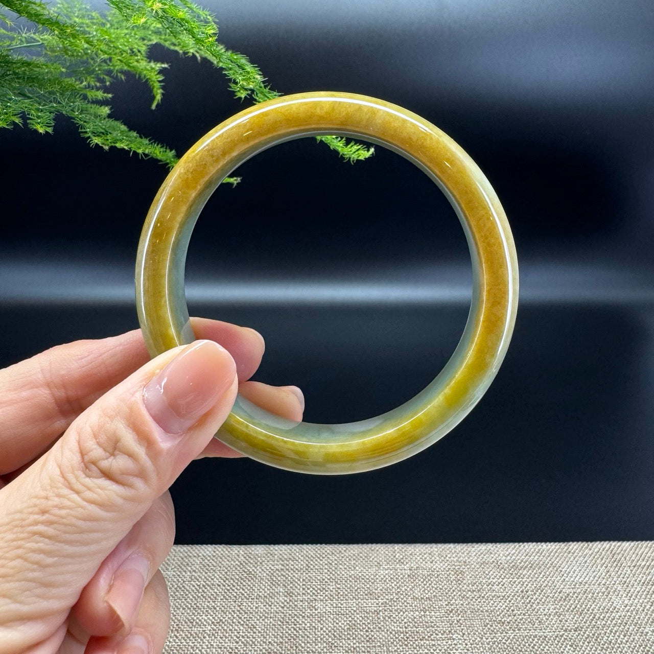 The bangle shape of the half round.The bangle color is yellow green.