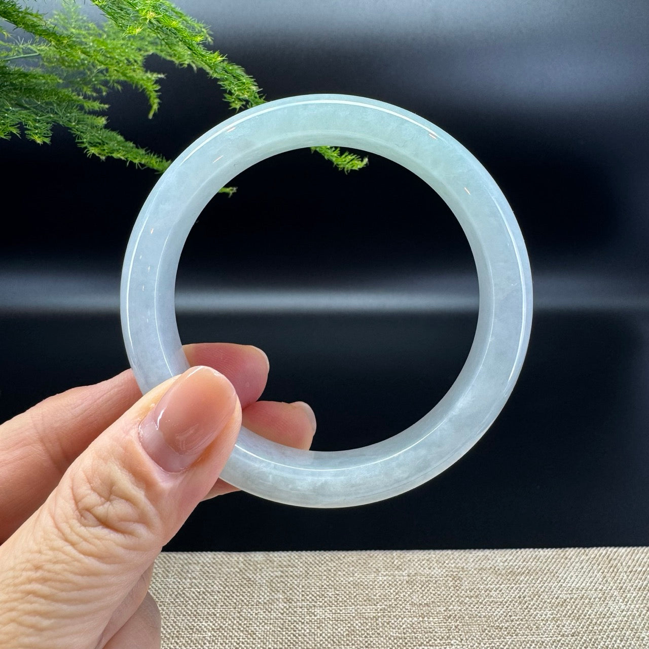 The bangle shape of the half round.The bangle color is icy lavender green.