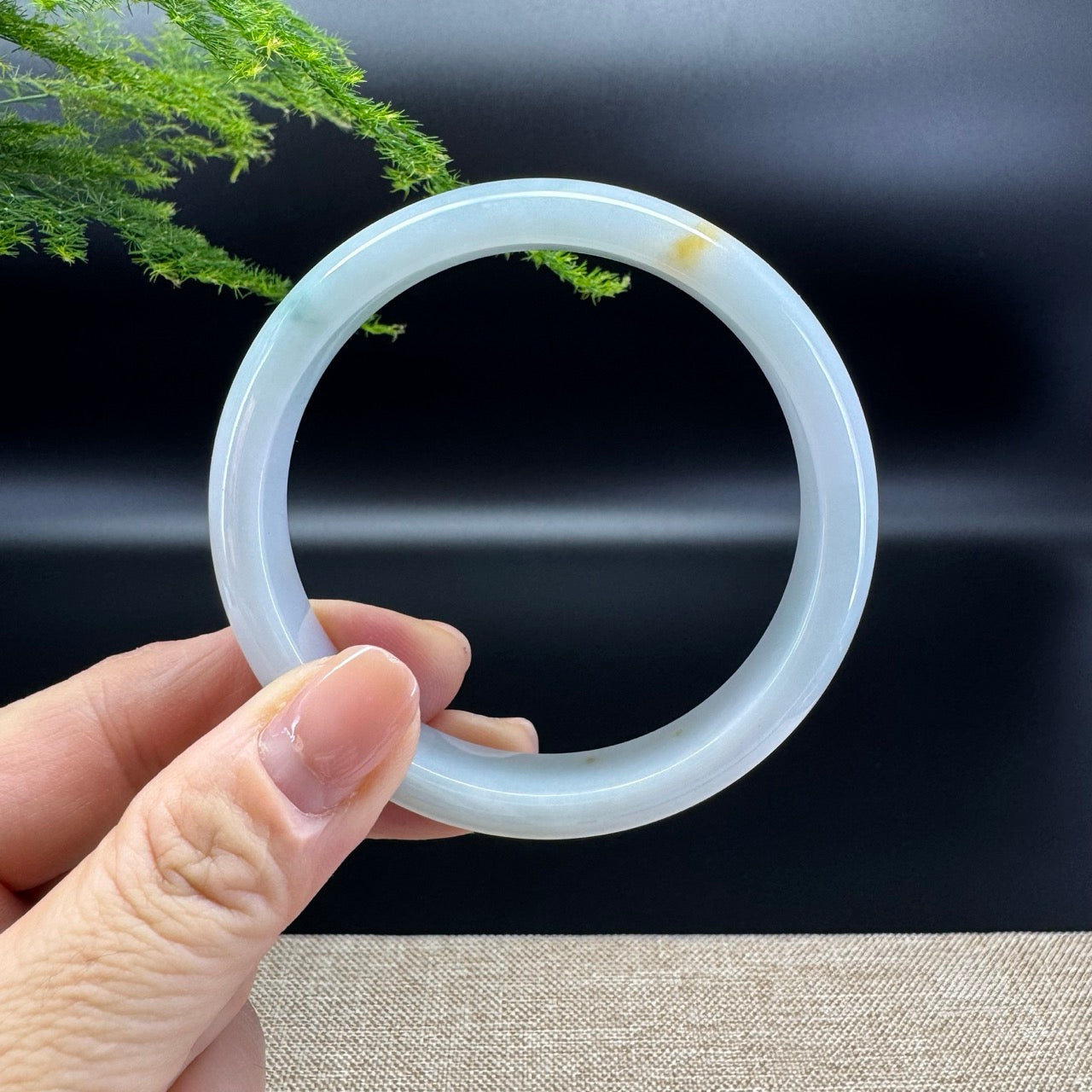 The bangle shape of the half round.The bangle color is icy green and a bit of yellow.