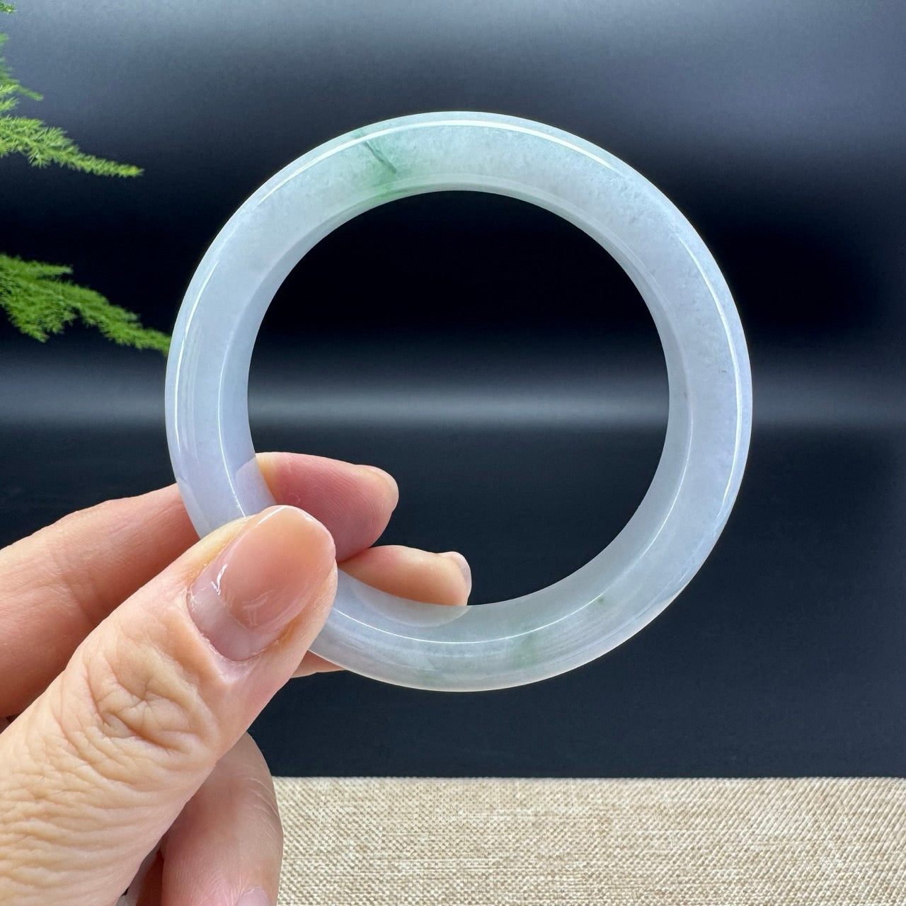 The bangle shape of the half round.The bangle color is icy green.