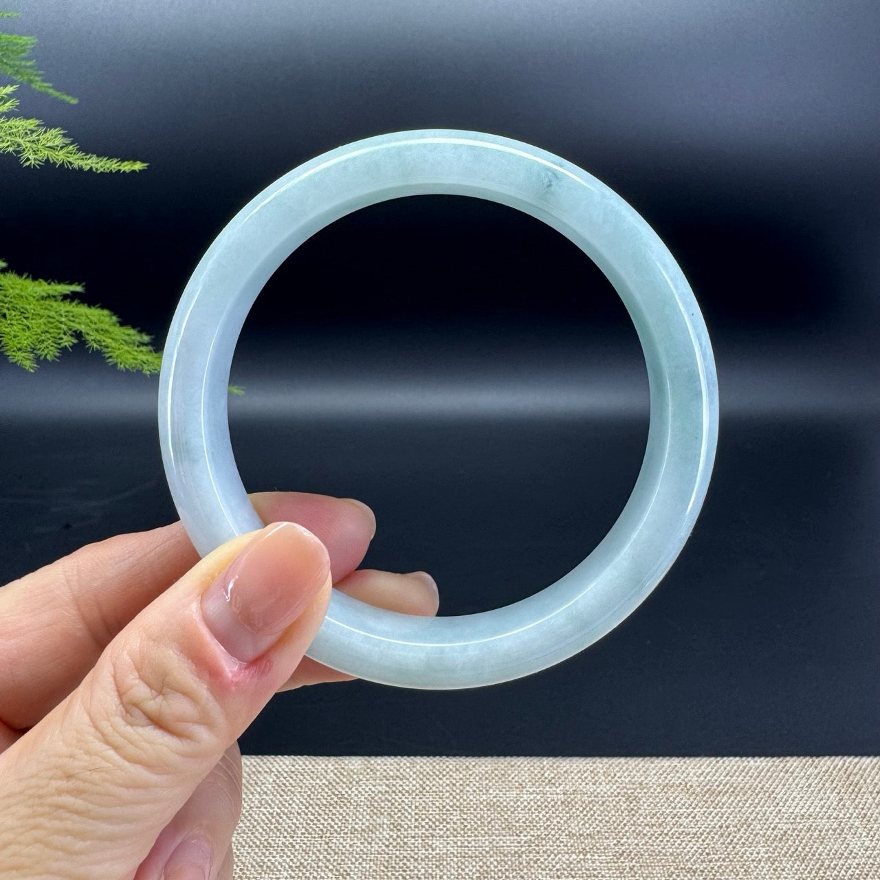 The bangle shape of the half round.The bangle color is icy green.