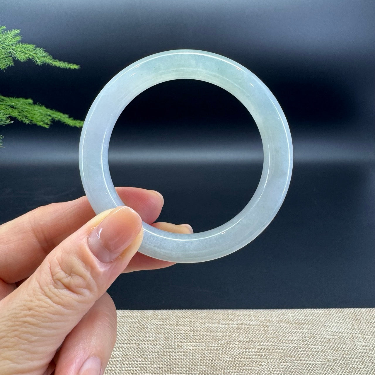 The bangle shape of the half round.The bangle color is green.