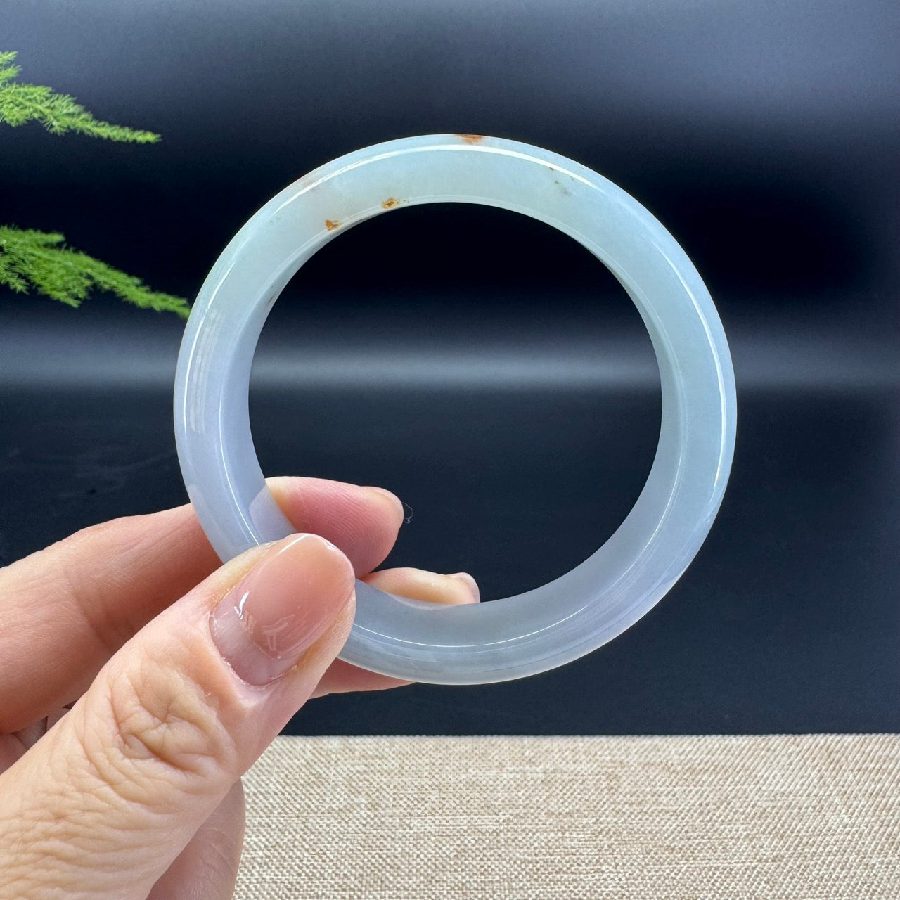 The bangle shape of the half round.The bangle color is lavender green and a bit of sajin.