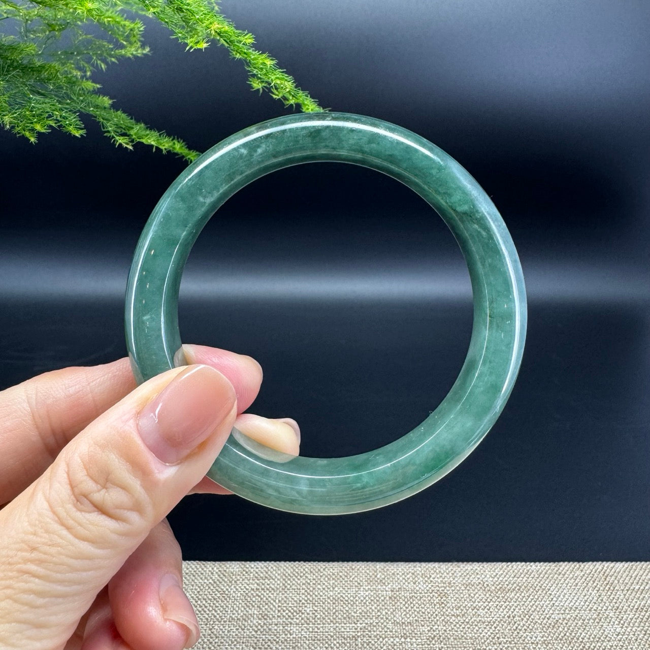 The bangle shape of the half round.The bangle color is oil green.