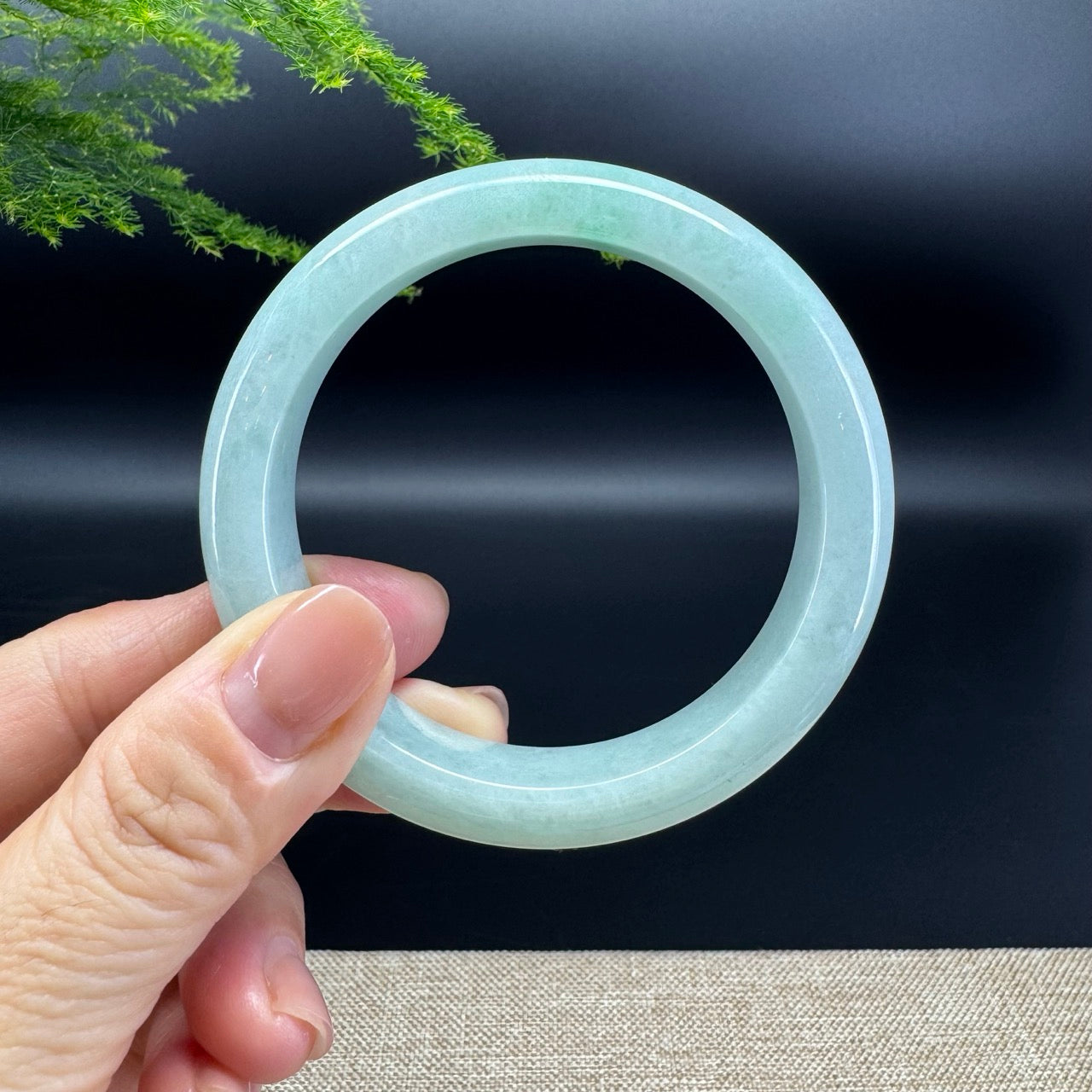 The bangle shape of the half round.The bangle color is icy green.