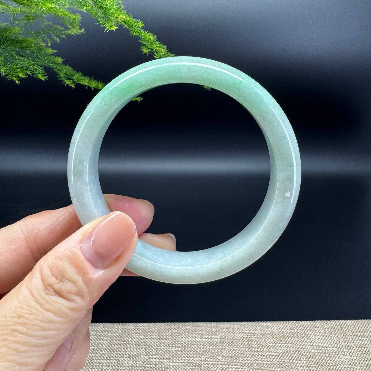 The bangle shape of the half round.The bangle color is icy green.
