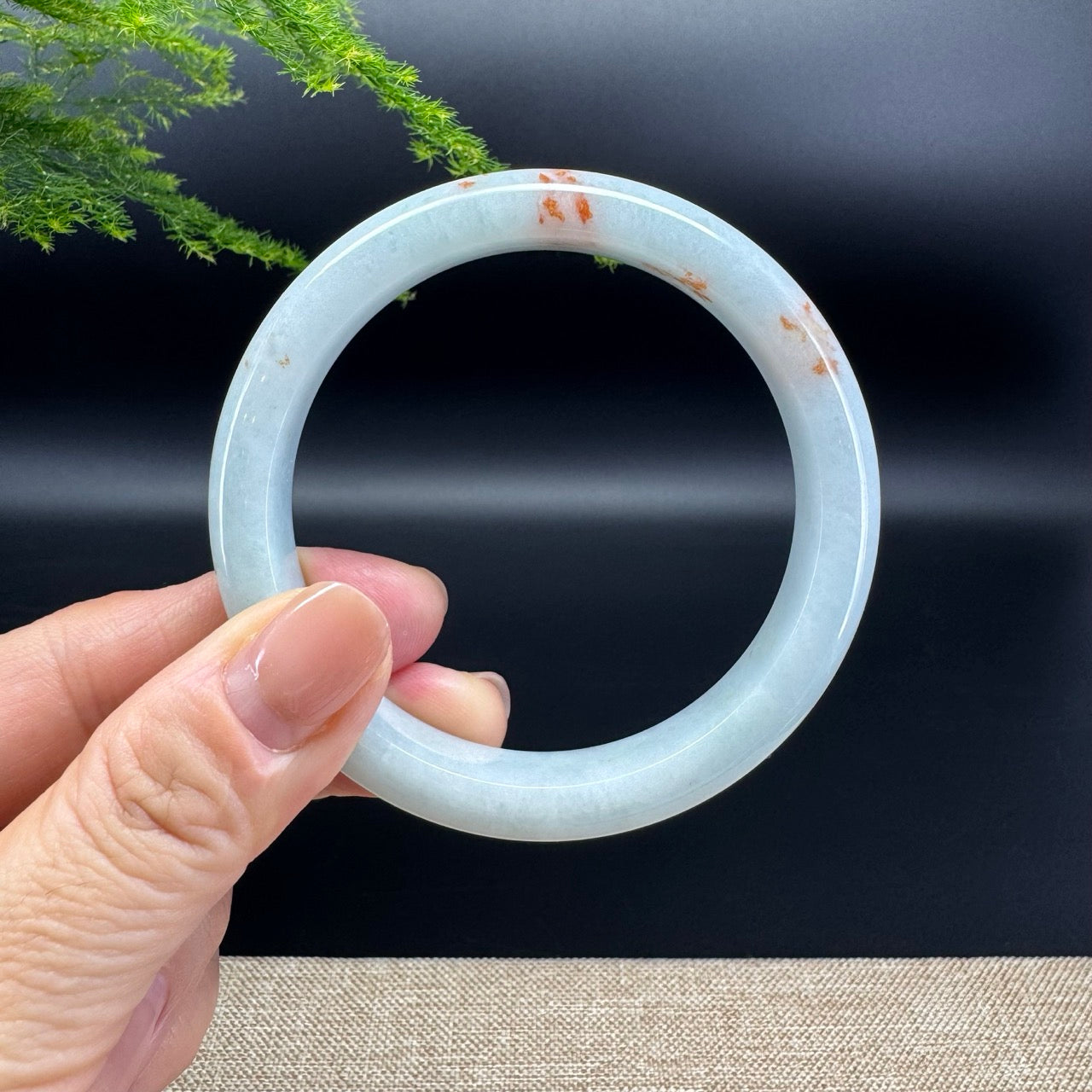 The bangle shape of the half round.The bangle color is icy green and some sajin.