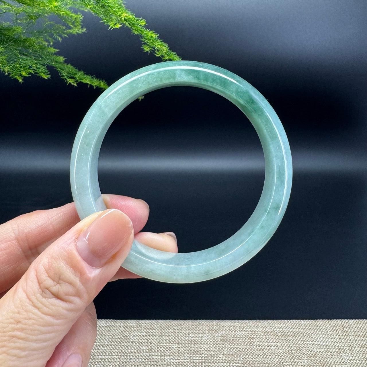 The bangle shape of the half round.The bangle color is oil green.