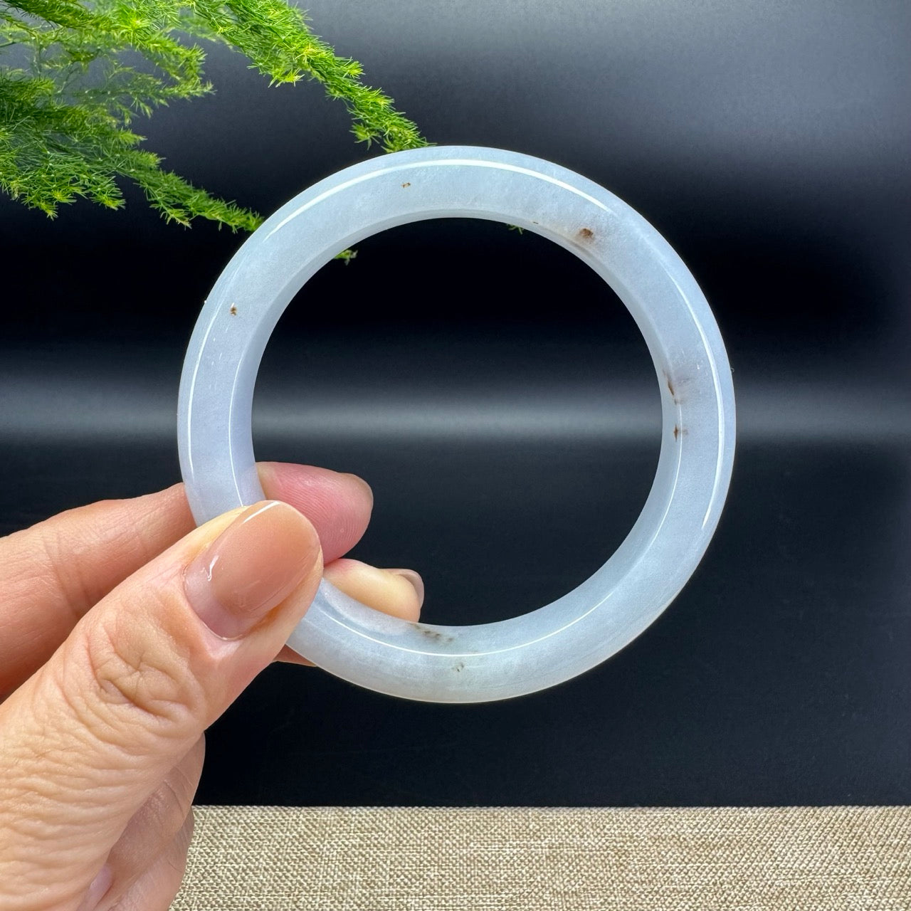 The bangle shape of the half round.The bangle color is lavender.