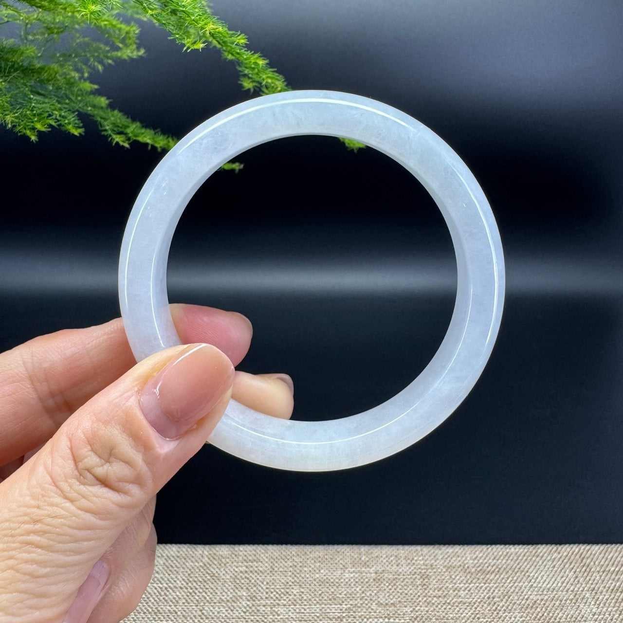 The bangle shape of the half round.The bangle color is lavender.