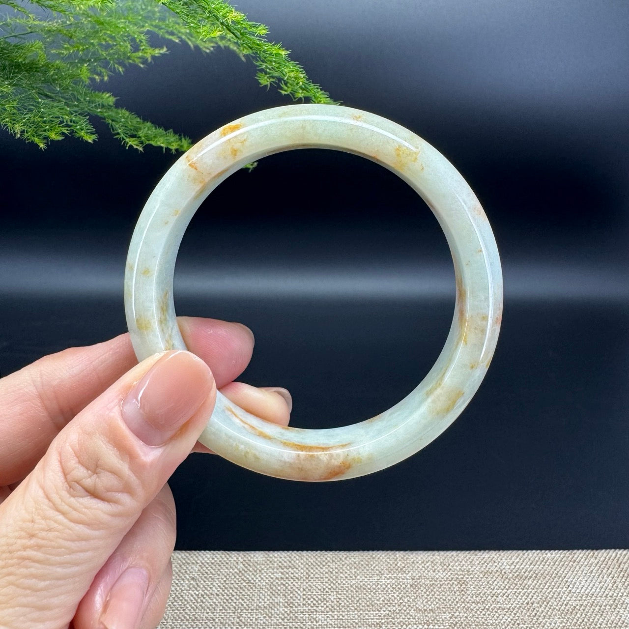 The bangle shape of the alf round.The bangle color is yellow green.