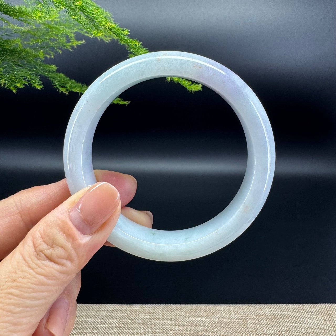 The bangle shape of the half round.The bangle color is lavender green.