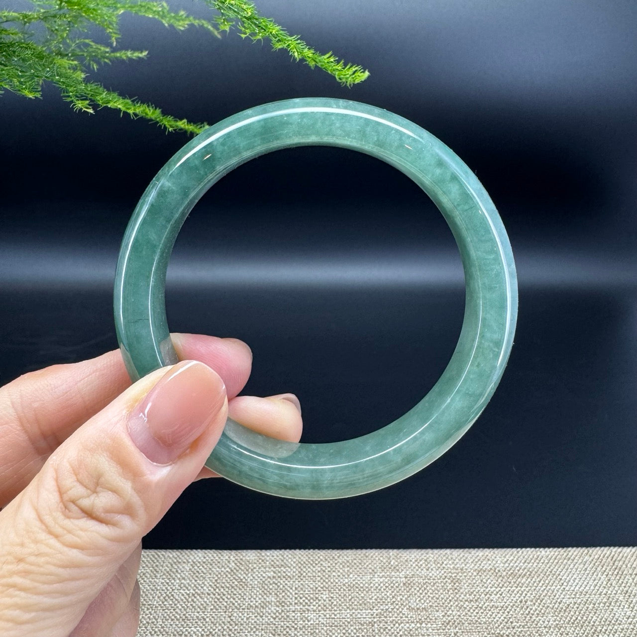 The bangle shape of the half round.The bangle color is green.