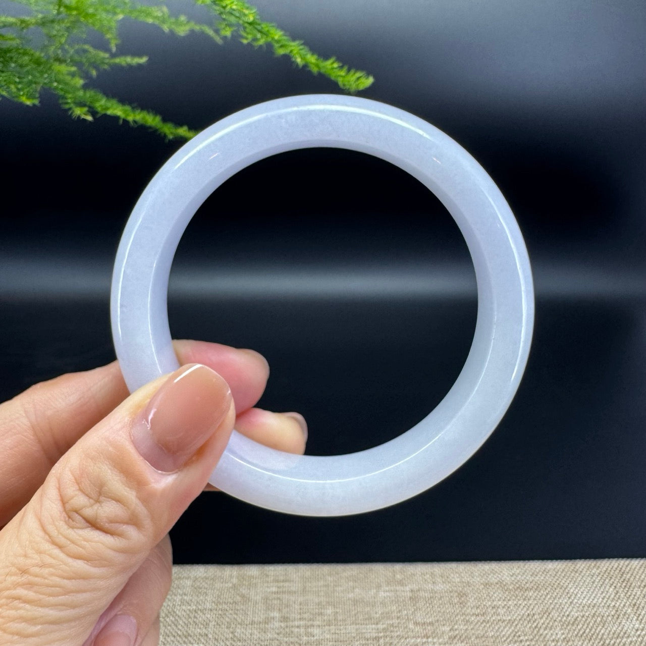 The bangle shape of the half round.The bangle color is lavender.