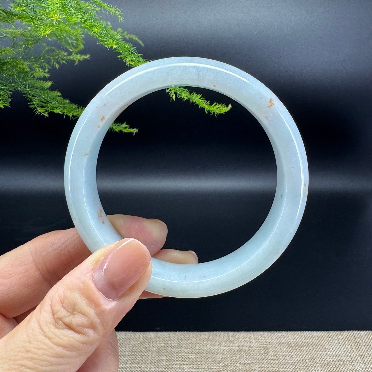 The bangle shape of the half round.The bangle color is icy green.