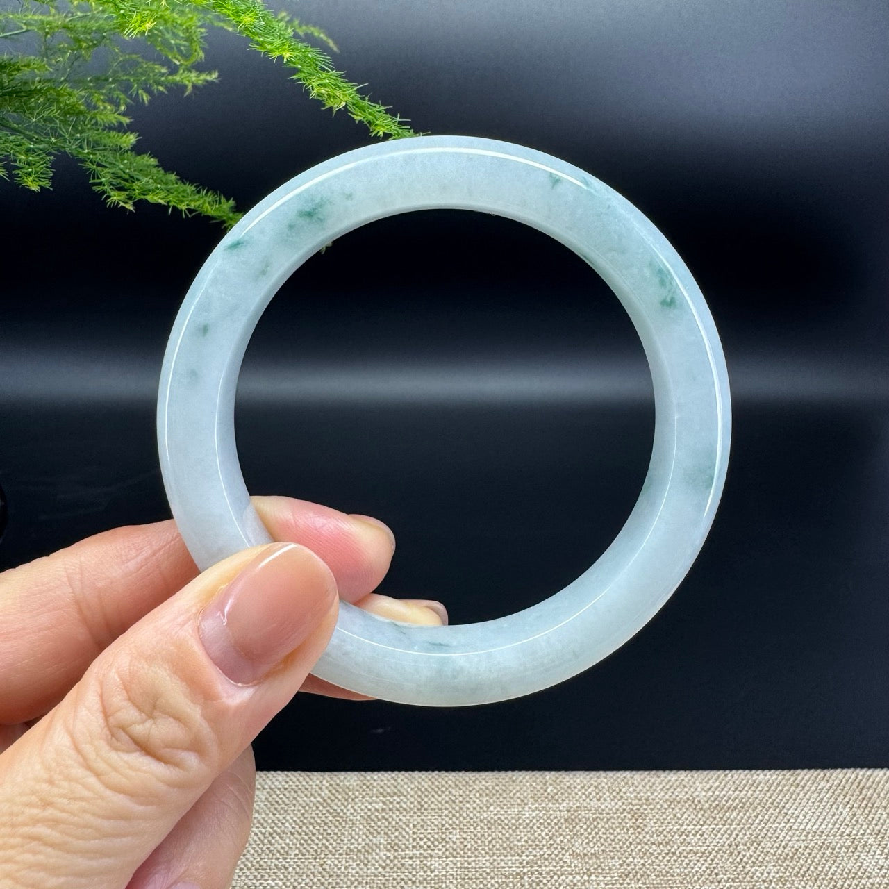 The bangle shape of the half round.The bangle color is icy oil green.