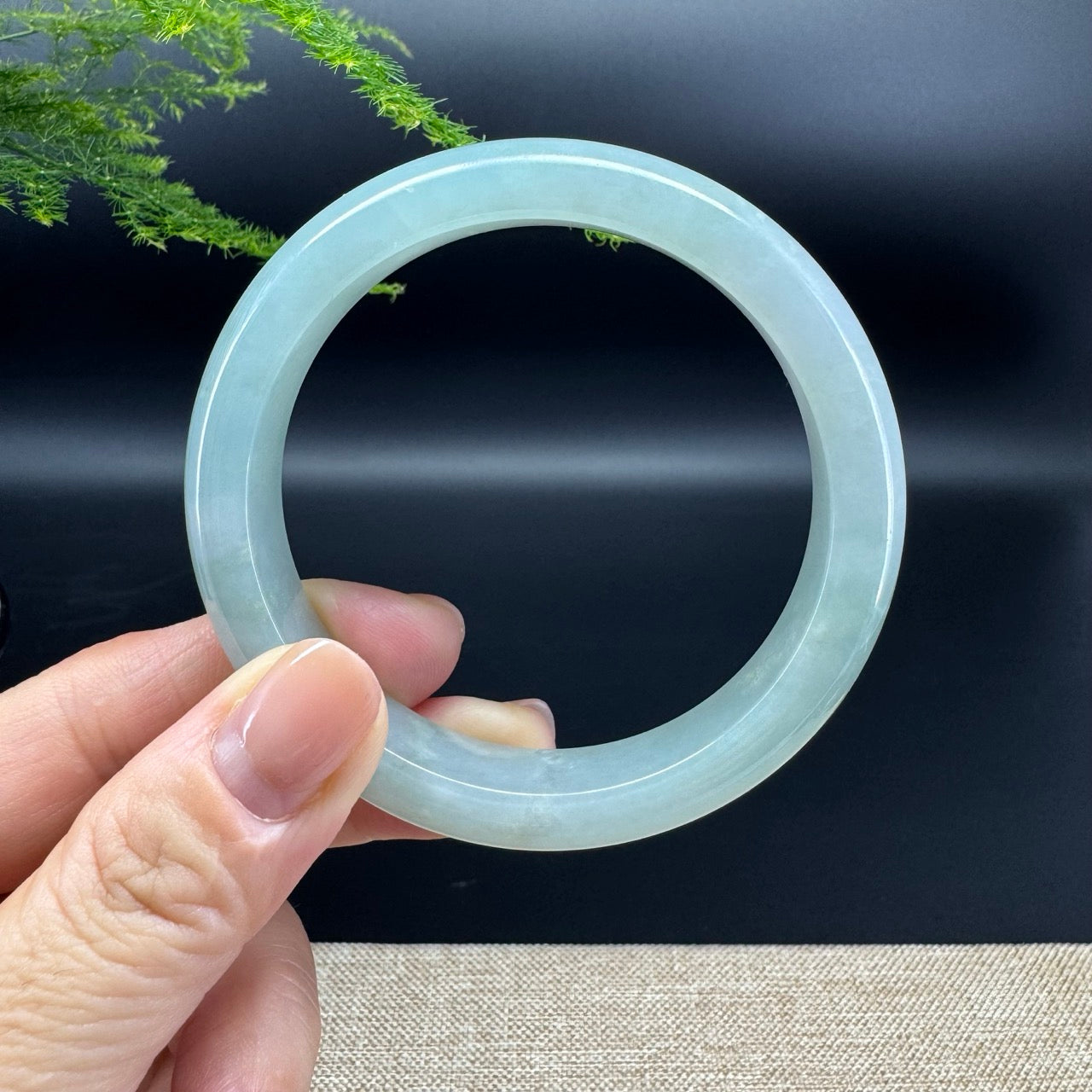 The bangle shape of the half round.The bangle color is icy green.