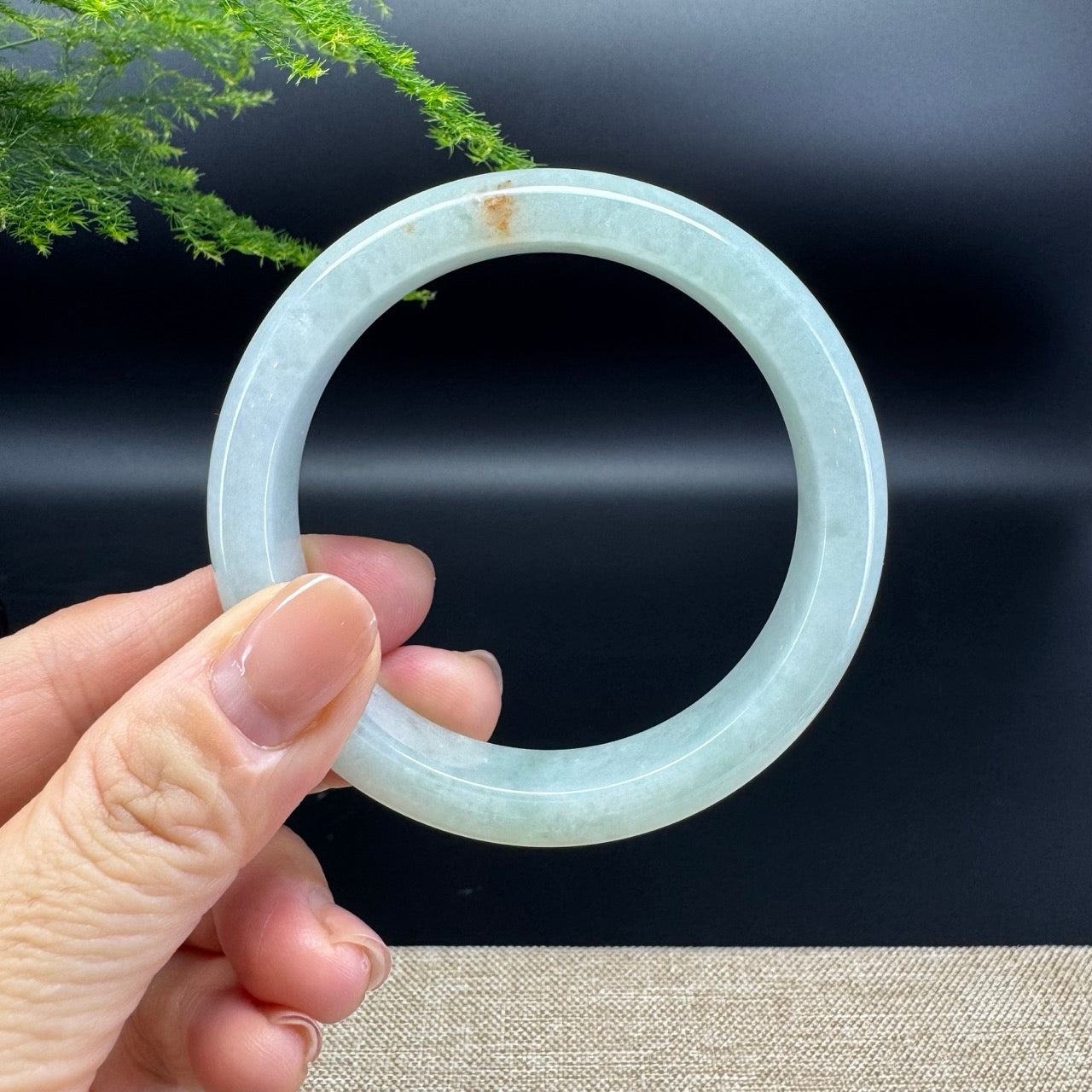 The bangle shape of the half round.The bangle color is icy green.
