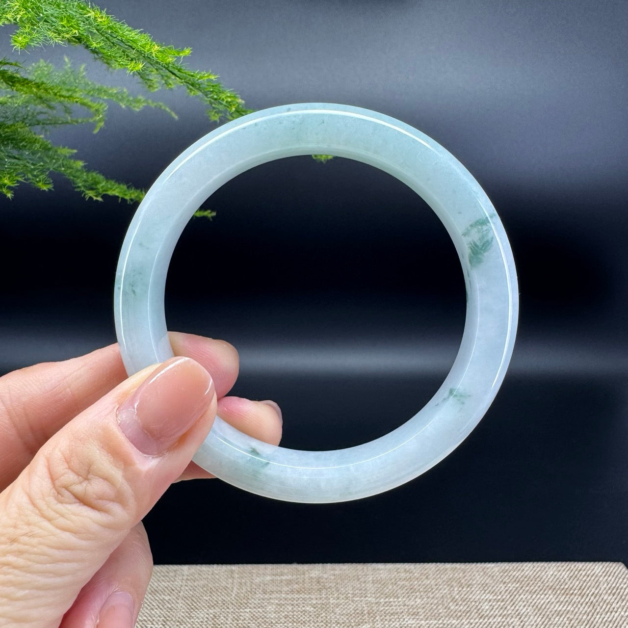 The bangle shape of the half round.The bangle color is icy green.