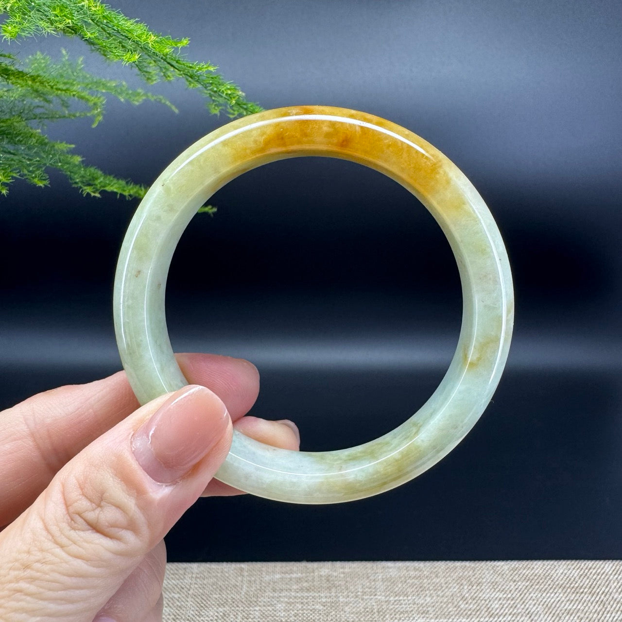 The bangle shape of the half round.The bangle color is yellow green.